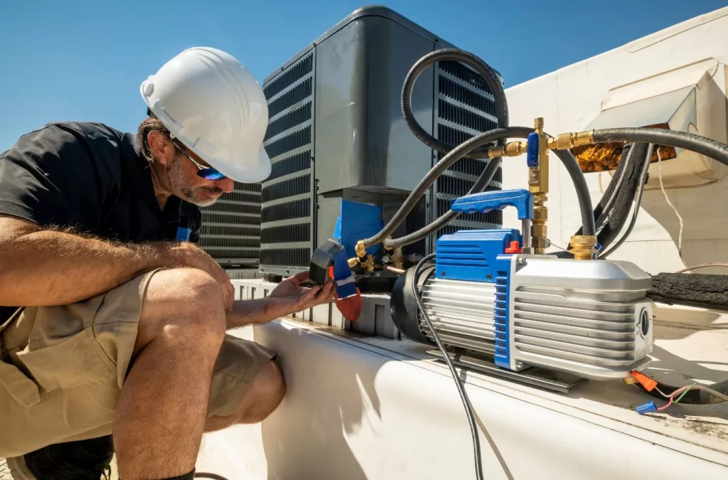 Reliable plumbing and HVAC services in Gunbarrel, CO by MESA PLUMBING, featuring a technician inspecting an HVAC system.