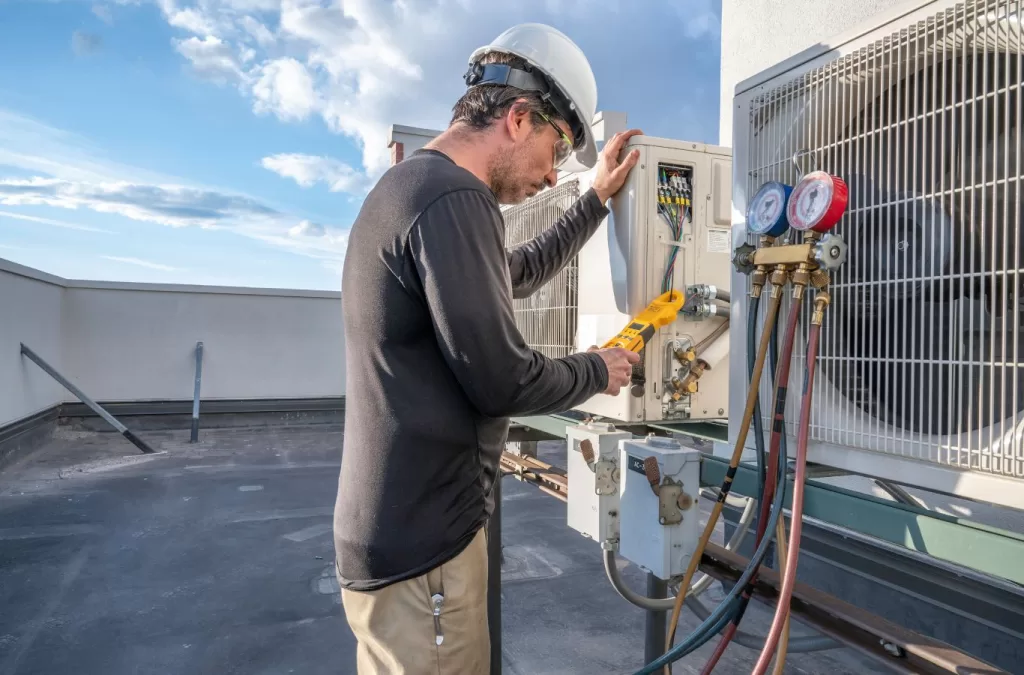 Expert plumbing and HVAC services in Longmont, CO by MESA PLUMBING, showing a technician installing an HVAC system.