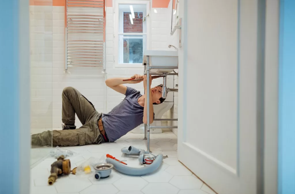 Professional plumbing and HVAC services in Superior, CO by MESA PLUMBING, featuring a technician working on an HVAC unit.