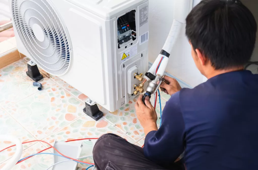 A MESA Plumbing technician offering exceptional Air Conditioner Repair Services, demonstrating our commitment to quality and reliability. Air Conditioner Repair Services near me.